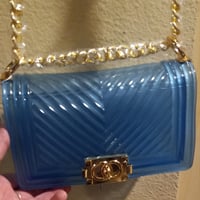 Blue plastic crossbody purse